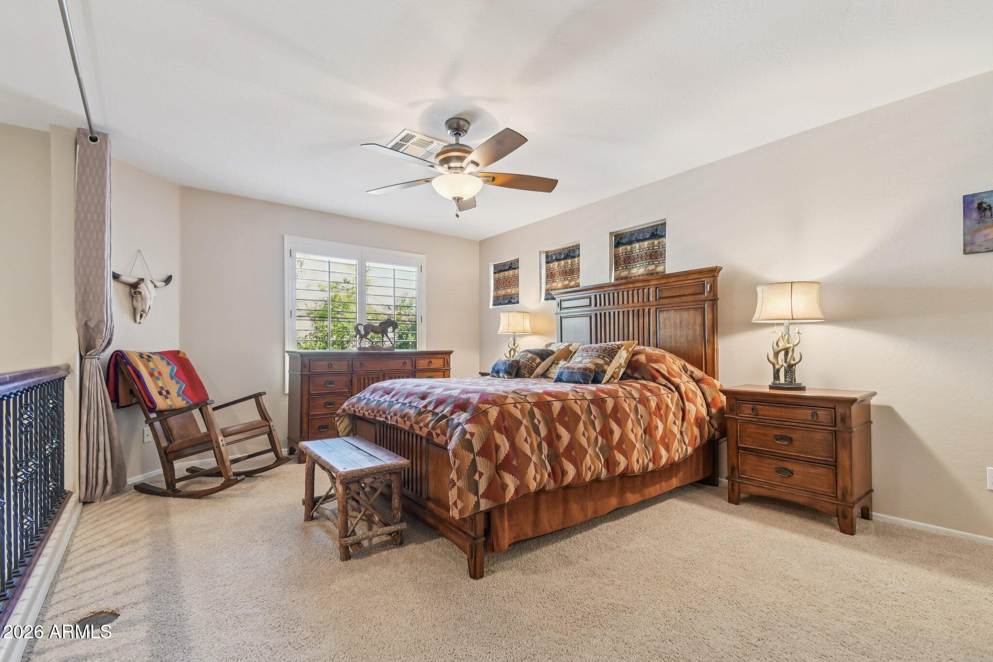 1024 East Frye Road, Unit 1039 Phoenix, AZ 85048 - Photo 18 of 32 a spacious bedroom with a bed and a window