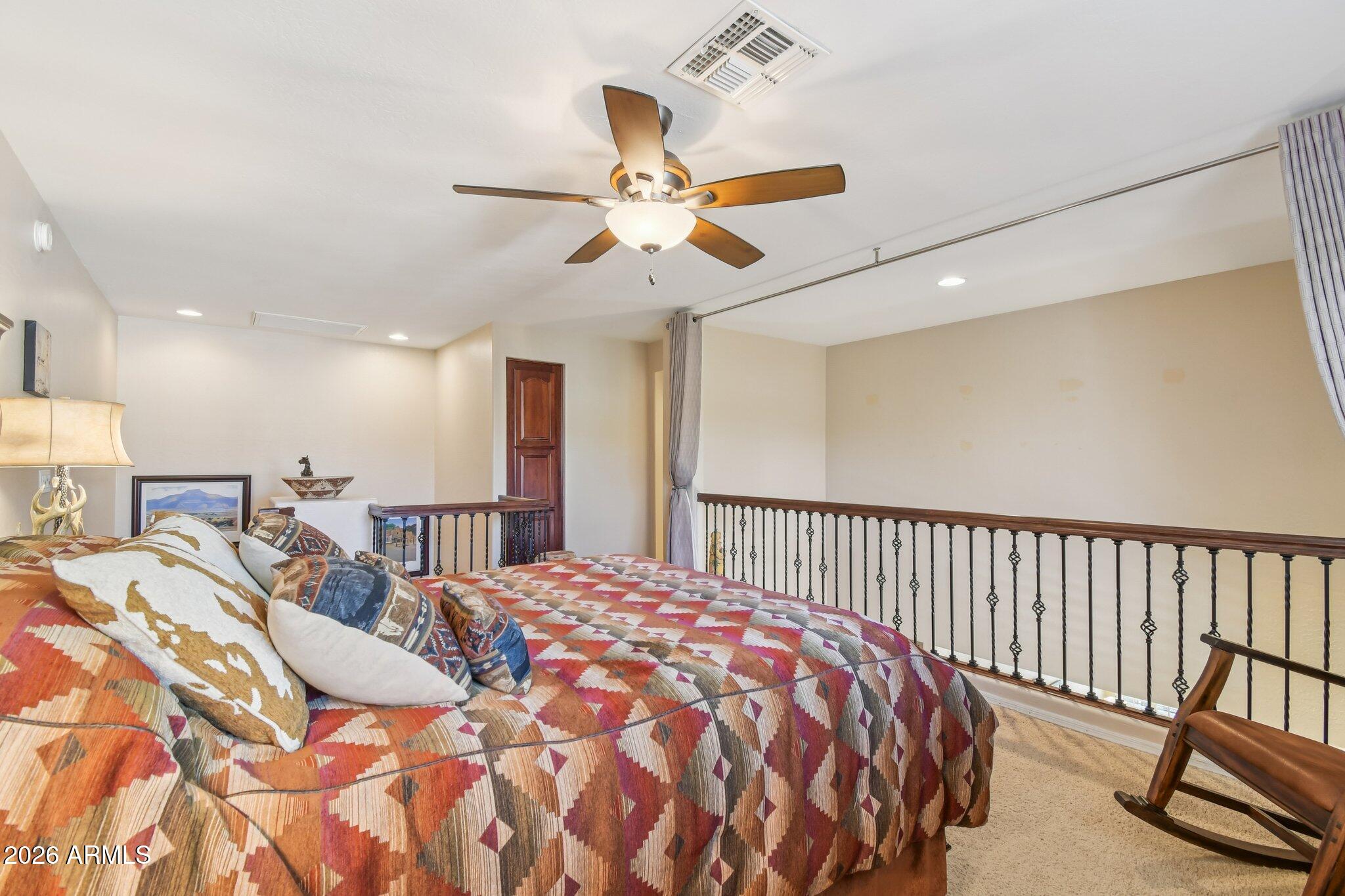 1024 East Frye Road, Unit 1039 Phoenix, AZ 85048 - Photo 19 of 32 a bed sitting in a bedroom next to a window