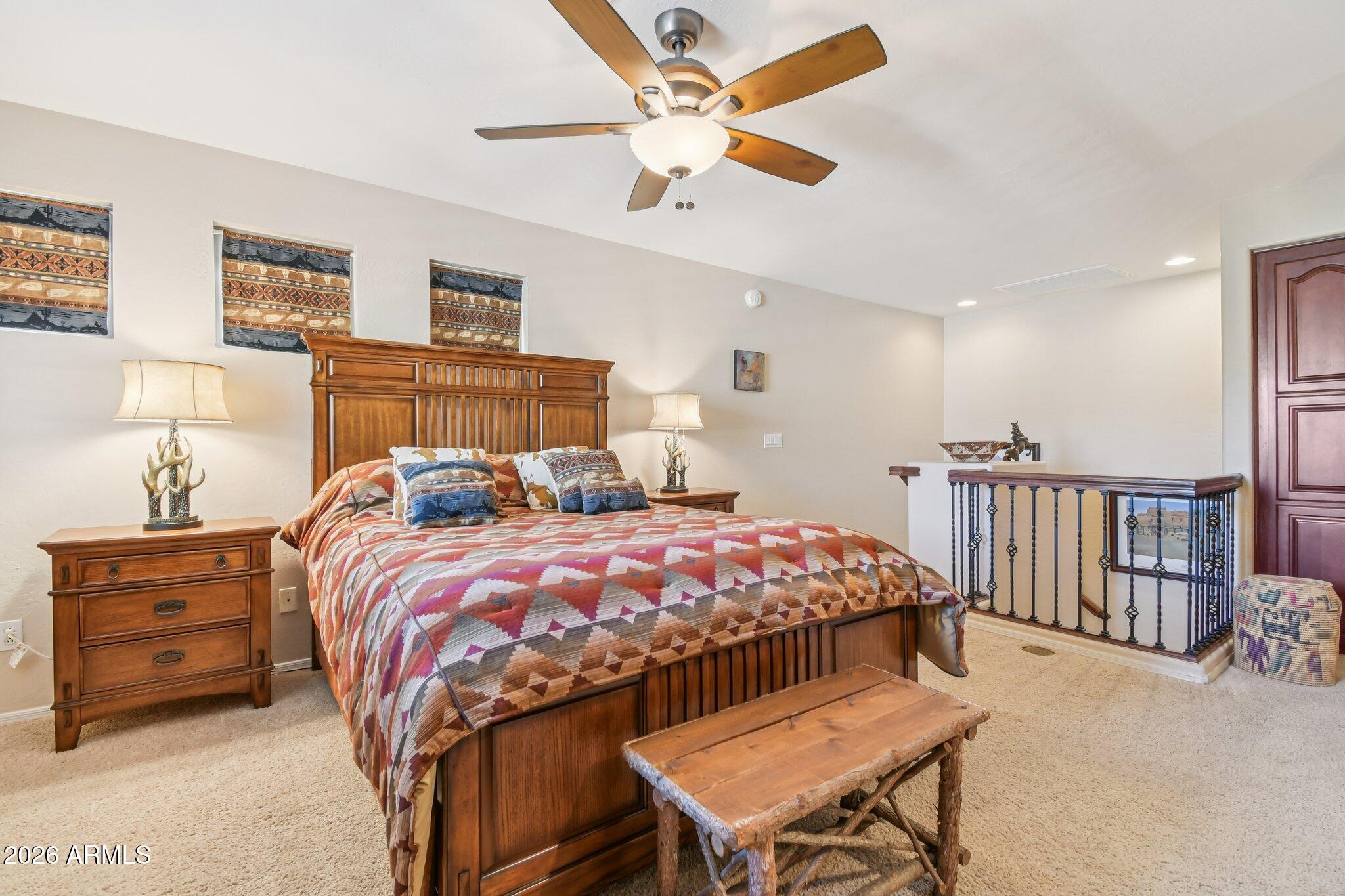 1024 East Frye Road, Unit 1039 Phoenix, AZ 85048 - Photo 20 of 32 a bed room with a bed and a chandelier