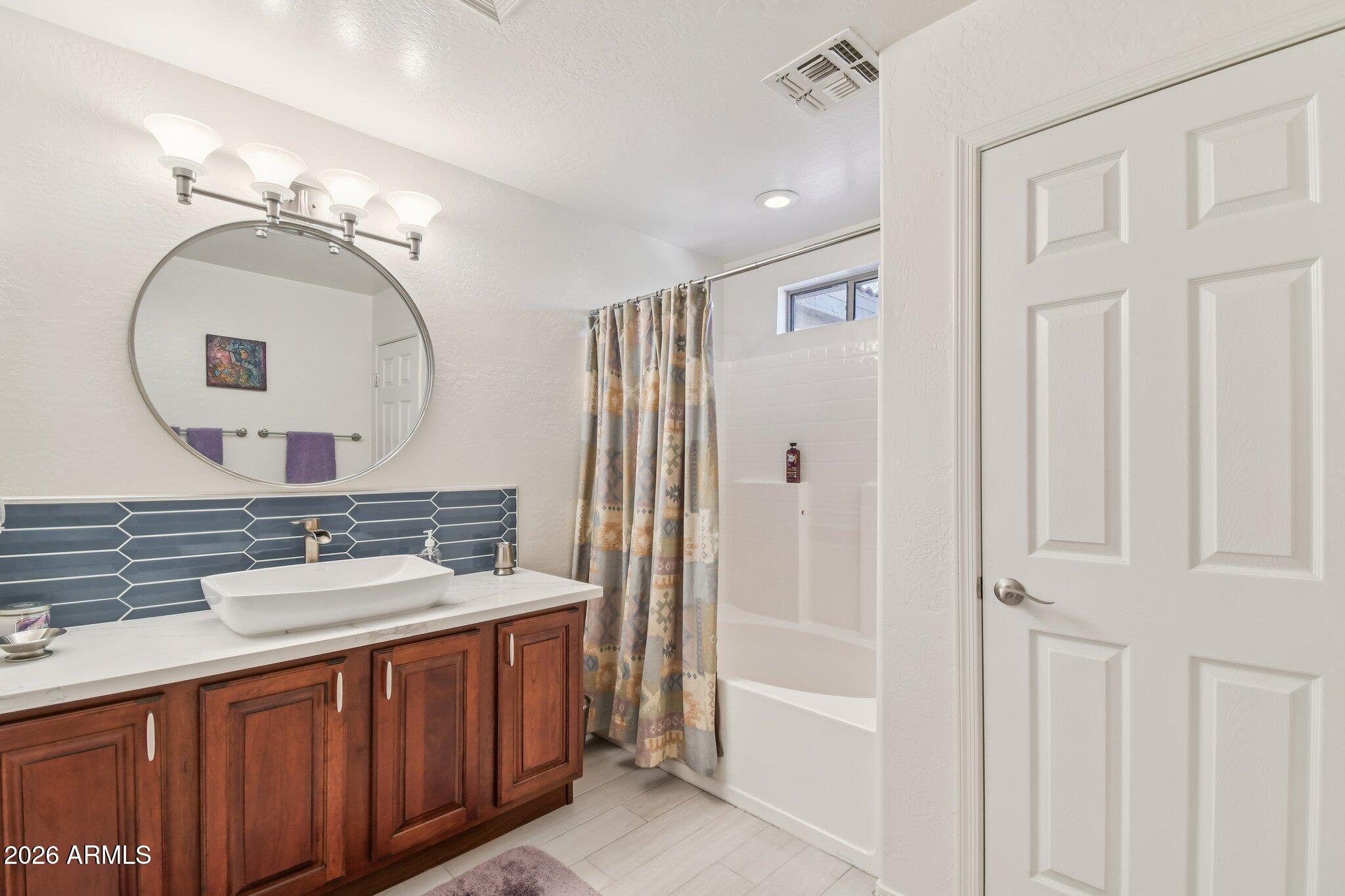 1024 East Frye Road, Unit 1039 Phoenix, AZ 85048 - Photo 21 of 32 a bathroom with a double vanity sink and a mirror