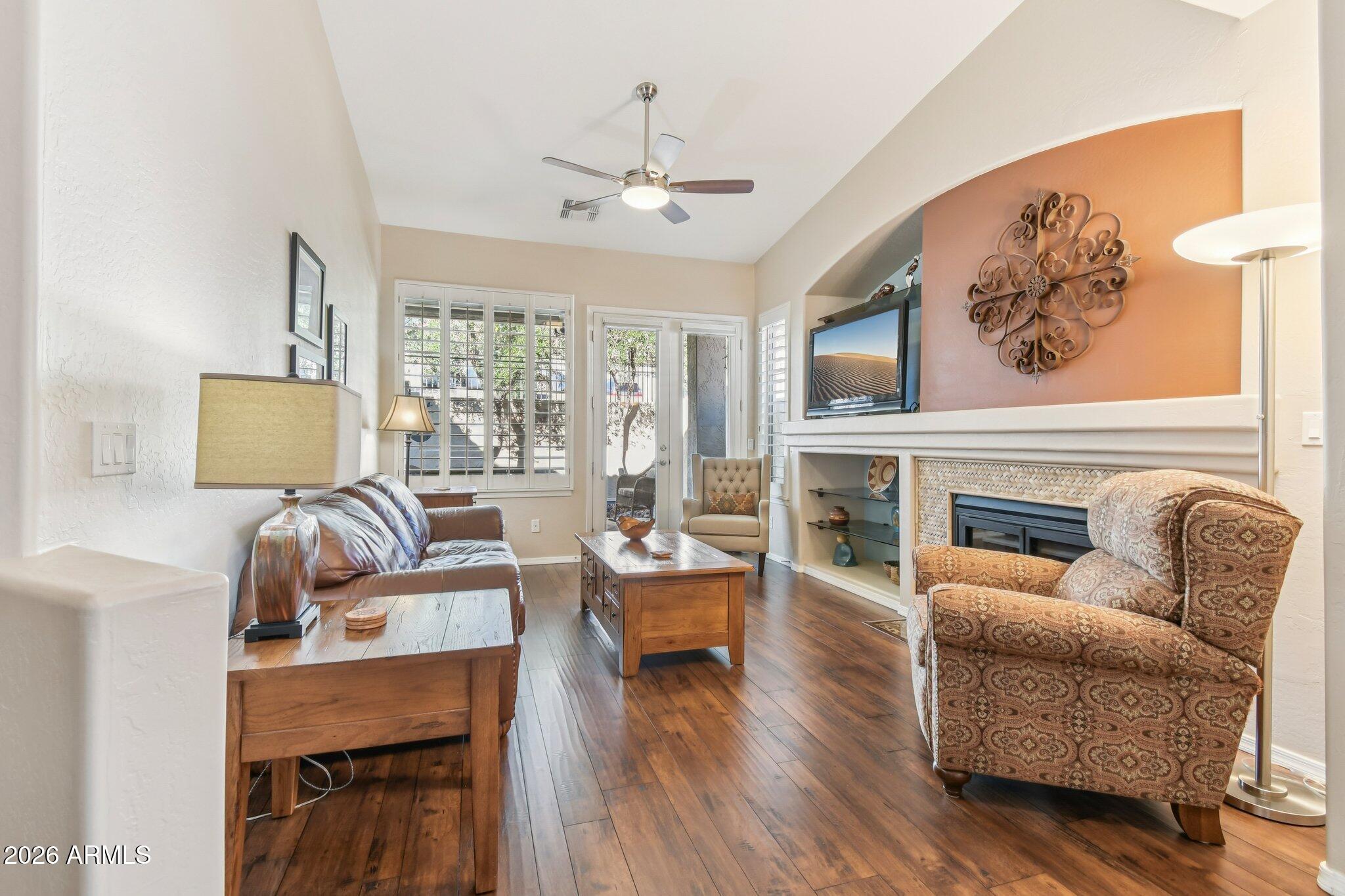 1024 East Frye Road, Unit 1039 Phoenix, AZ 85048 - Photo 3 of 32 a living room with furniture and a fireplace