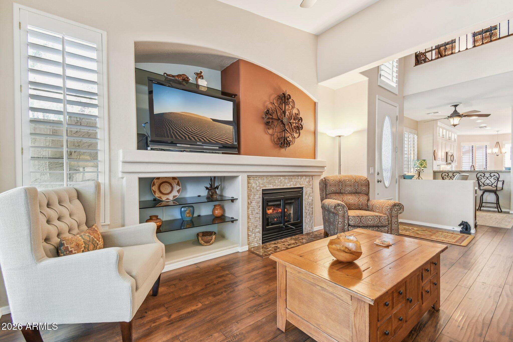 1024 East Frye Road, Unit 1039 Phoenix, AZ 85048 - Photo 4 of 32 a living room with furniture and a fireplace