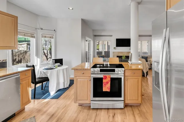 a kitchen with a stove sink and refrigerator