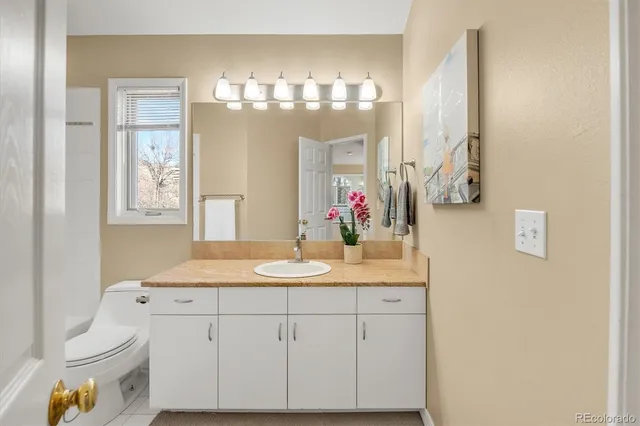 a spacious bedroom with a large bed and a window