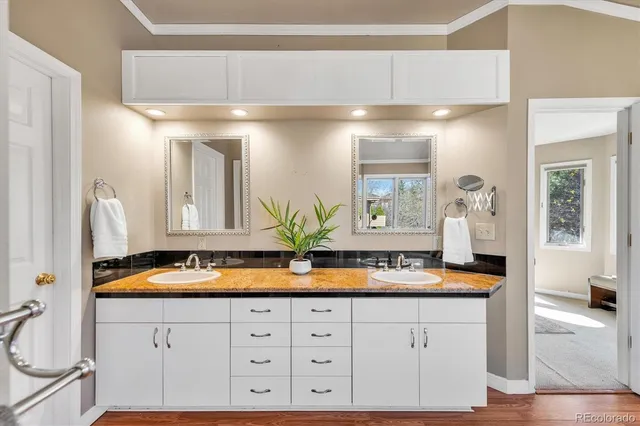 a spacious bathroom with a granite countertop tub sink and shower