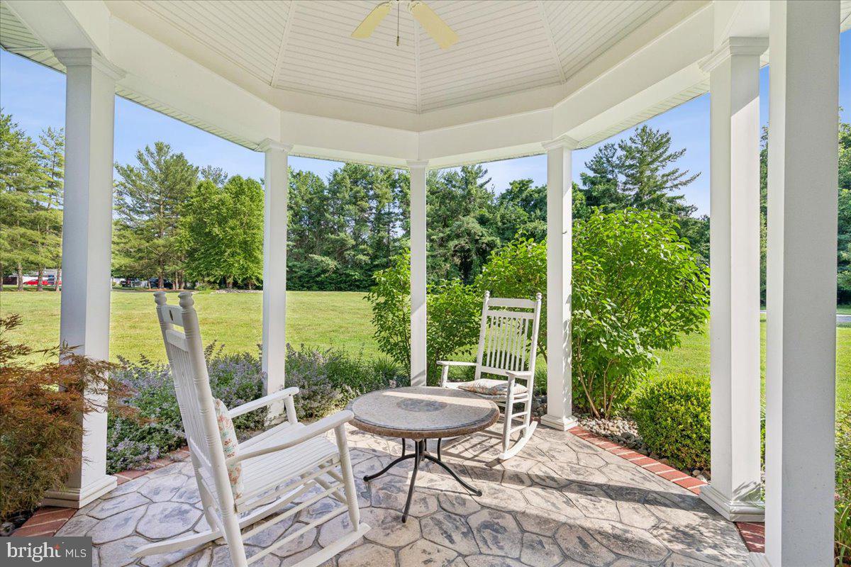 102 Little Neck Road Stevensville, MD 21666 - Photo 66 of 77 a view of a porch with furniture and wooden floor