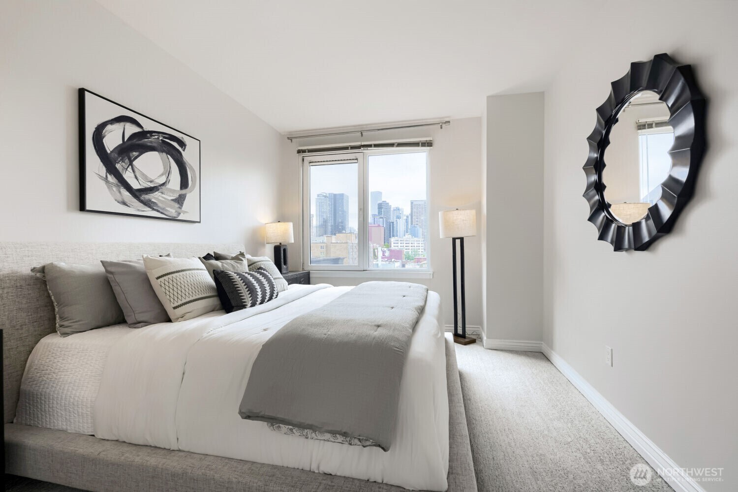 76 Cedar Street, Unit 1109 Seattle, WA 98121 - Photo 18 of 28 a bedroom with a bed and a painting on the wall