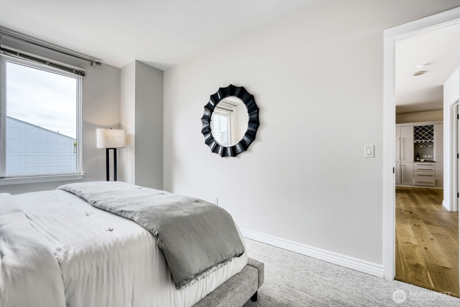 76 Cedar Street, Unit 1109 Seattle, WA 98121 - Photo 19 of 28 a bedroom with a bed and a painting on the wall