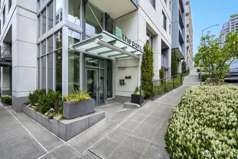 a view of a building with potted plants