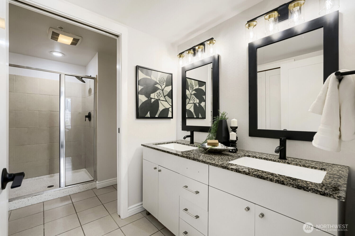 76 Cedar Street, Unit 1109 Seattle, WA 98121 - Photo 21 of 28 a bathroom with a granite countertop double vanity sink mirror and shower