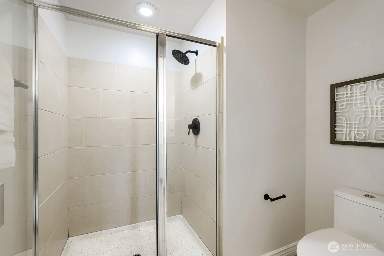 76 Cedar Street, Unit 1109 Seattle, WA 98121 - Photo 22 of 28 a bathroom with a shower and toilet
