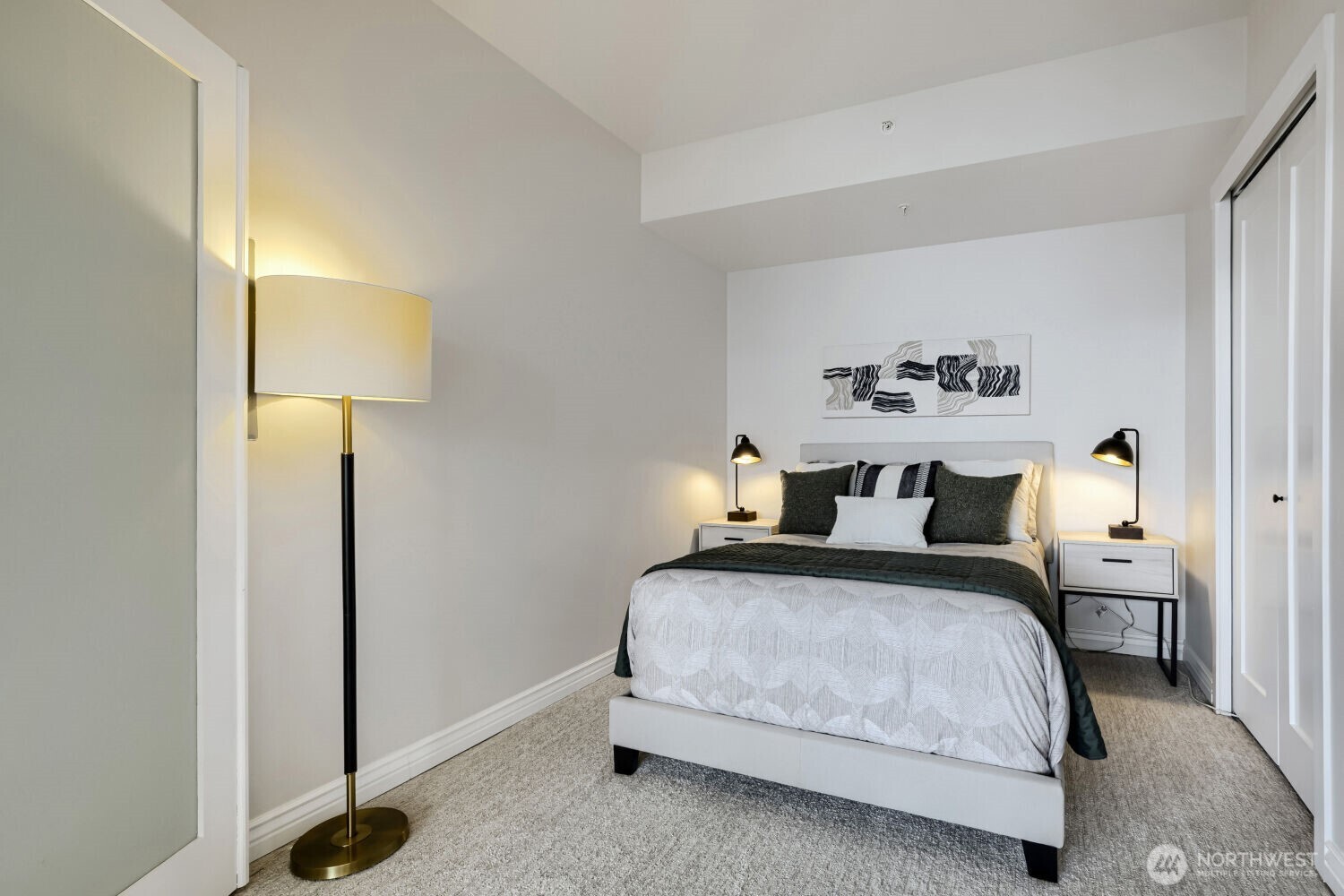 76 Cedar Street, Unit 1109 Seattle, WA 98121 - Photo 24 of 28 a bedroom with a bed and a lamp