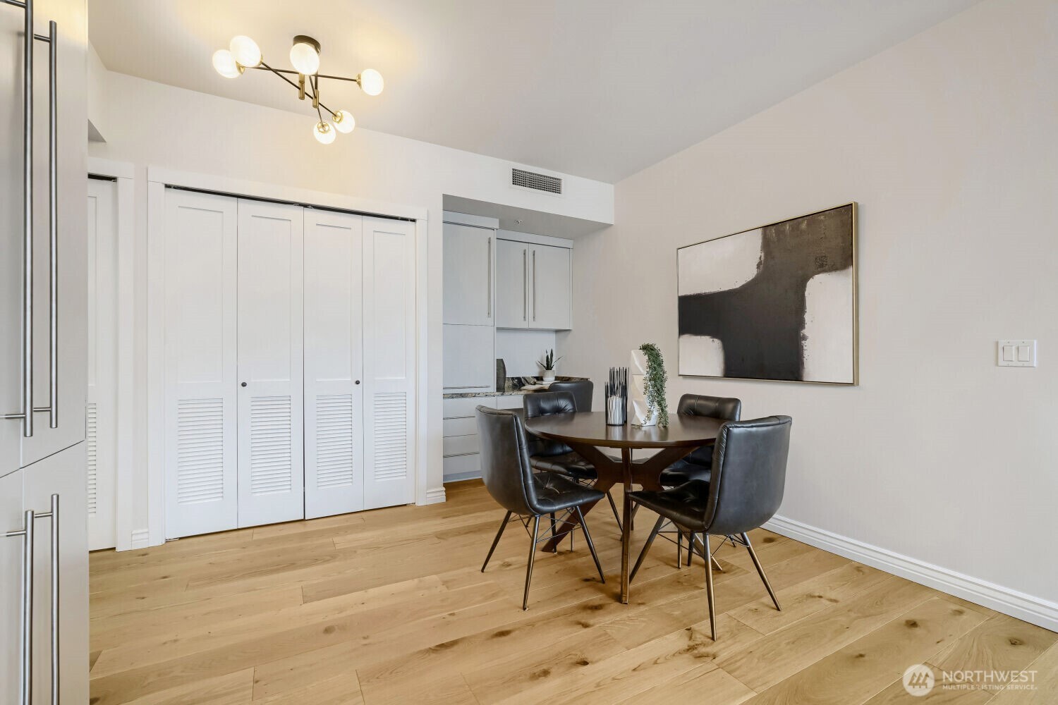 76 Cedar Street, Unit 1109 Seattle, WA 98121 - Photo 6 of 28 a view of a livingroom with furniture and wooden floor