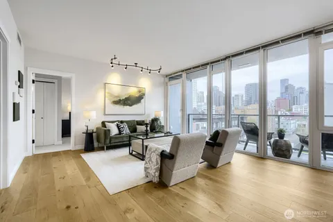 a living room with furniture and a large window