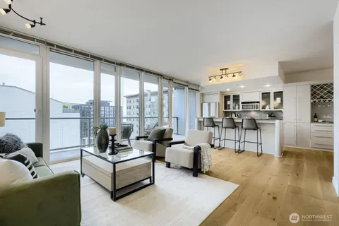 a living room with furniture and a table