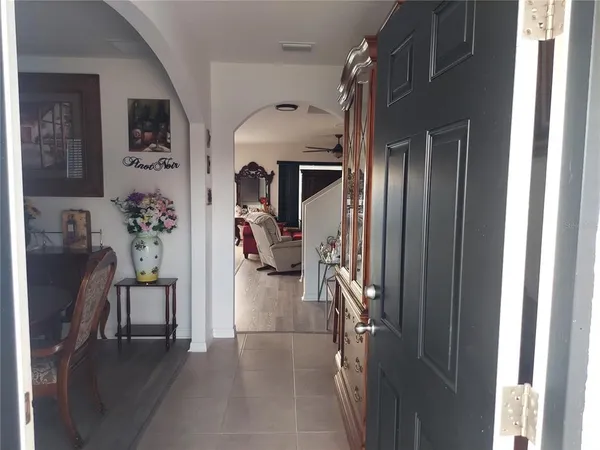 a view of a dining room with furniture and window