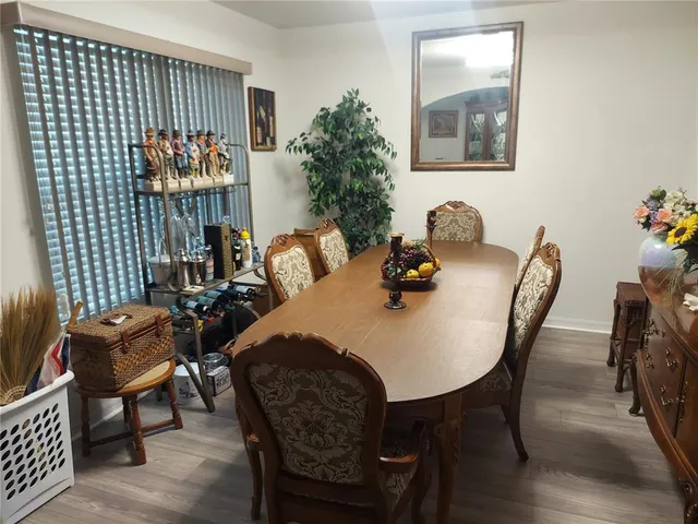 a kitchen with a dining table cabinets and a counter top space