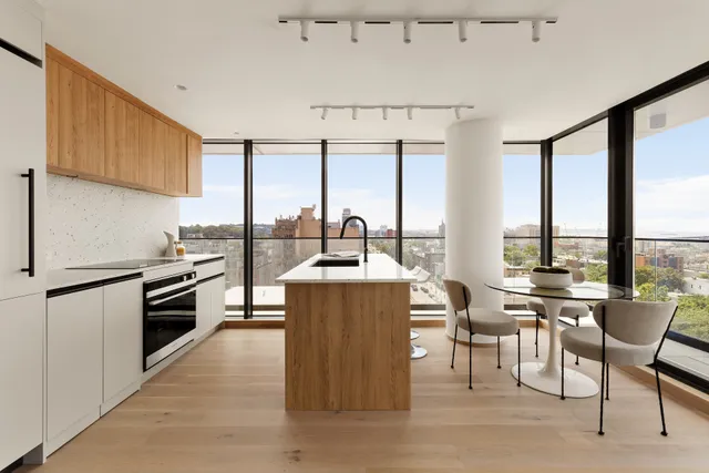 a kitchen with stainless steel appliances a stove a sink dishwasher and a refrigerator