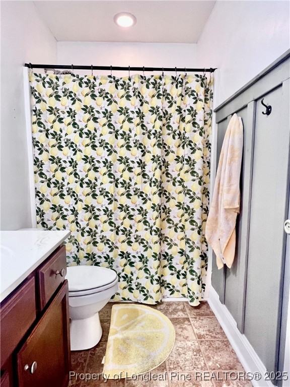 285 Pebble Lane Raeford, NC 28376 - Photo 5 of 7 a bathroom with a toilet and a shower curtain
