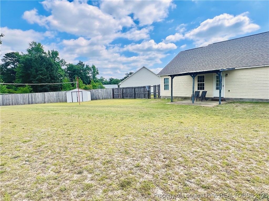 285 Pebble Lane Raeford, NC 28376 - Photo 7 of 7 a view of a swimming pool and a yard