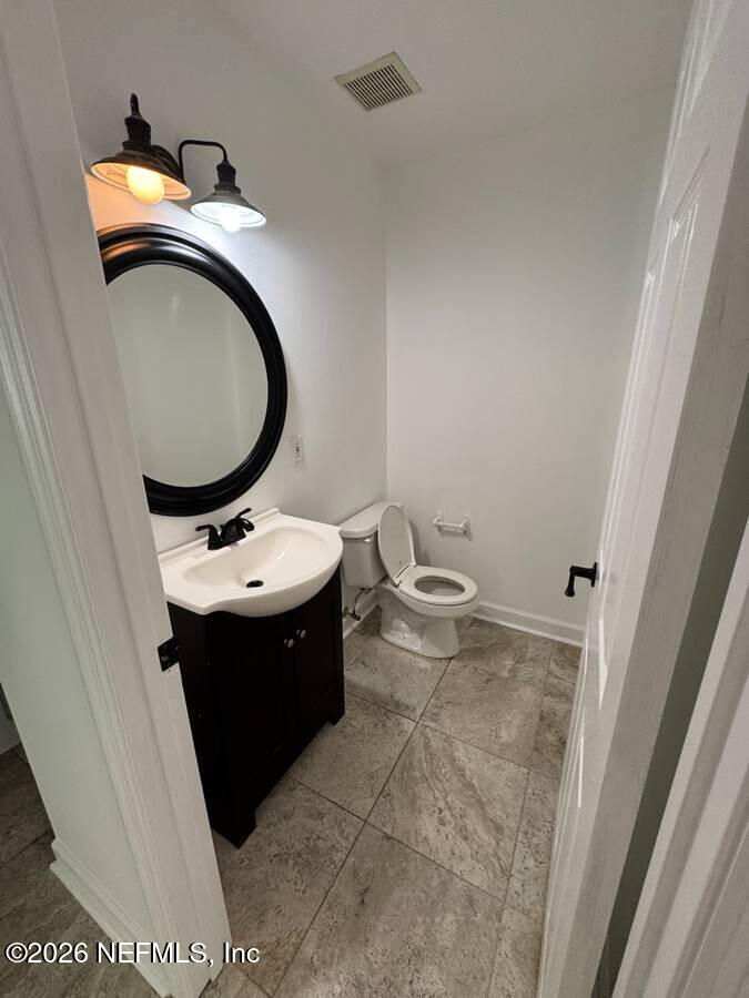 543 Ray Edwards Road St. Augustine, FL 32086 - Photo 7 of 19 a bathroom with a sink and mirror