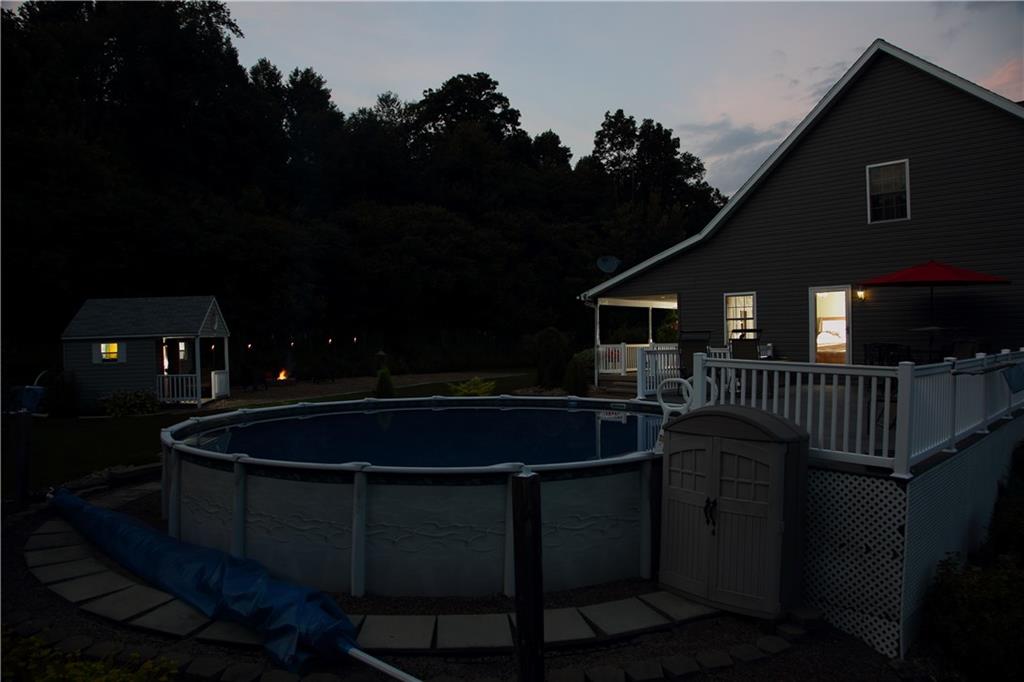 313 Tonkin Road Indiana, PA 15701 - Photo 14 of 14 Great entertainment area . . . wrap around deck, pool, firepit & dollhouse/playhouse/pool changing area . . . see the deer and listen to the crickets . . . schedule your visit today!!