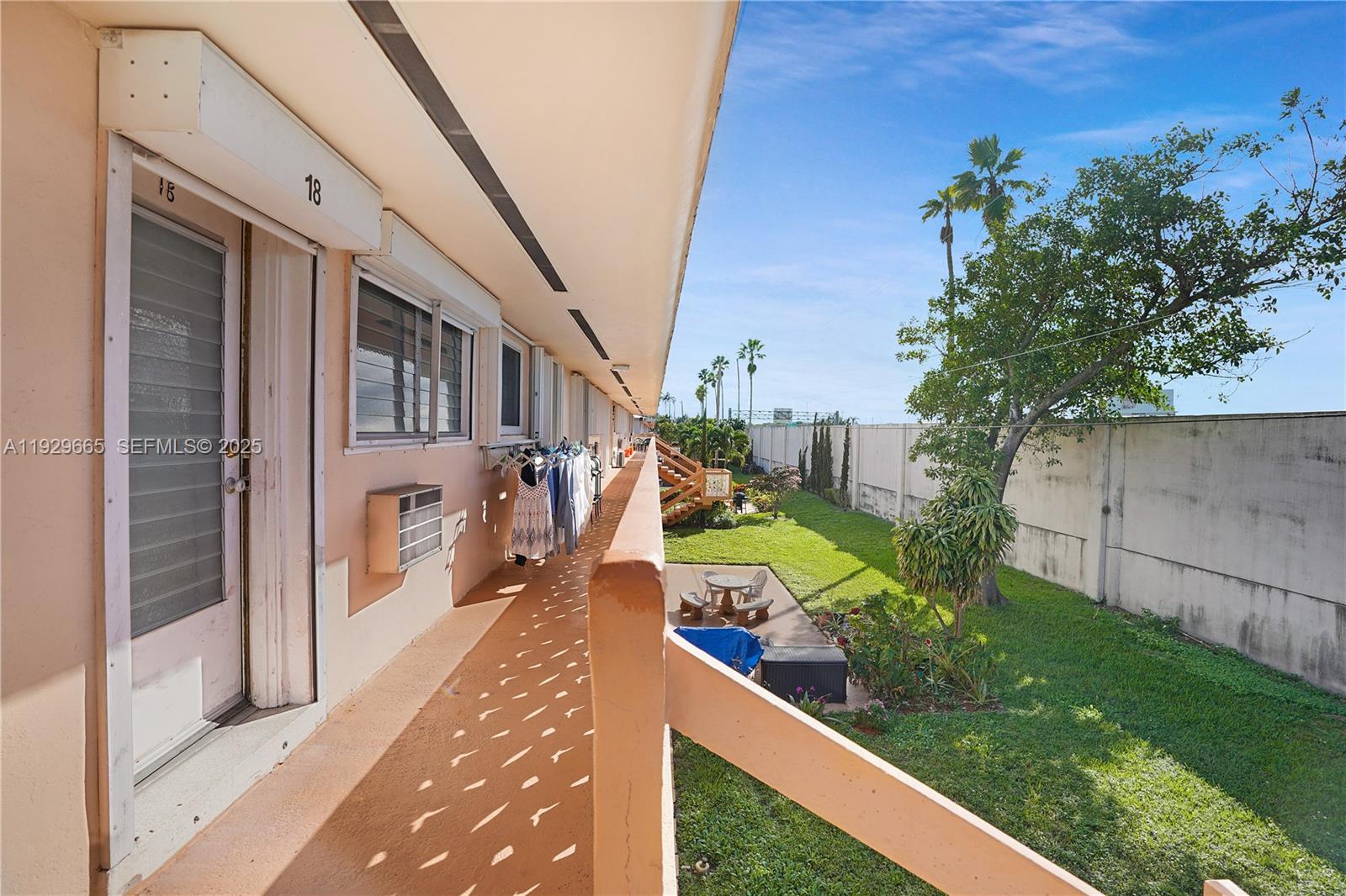 1000 Southwest 11th Avenue, Unit 20E Hallandale Beach, FL 33009 - Photo 10 of 12 a view of a garden with pathway