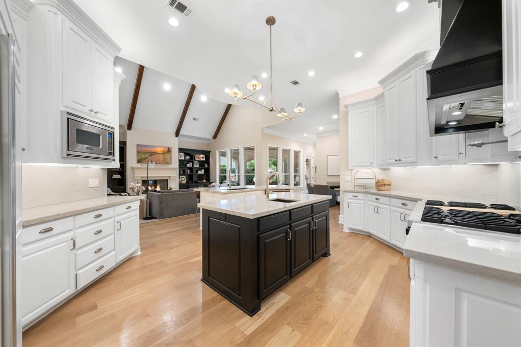 2101 Vail Road Southlake, TX 76092 - Photo 12 of 40 a large kitchen with stainless steel appliances and white cabinets