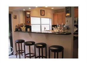 6115 Via Laguna Lane Boca Raton, FL 33433 - Photo 8 of 14 a kitchen view with table and chairs