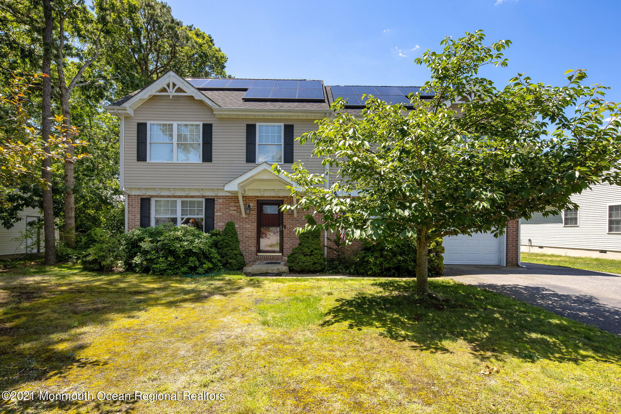 245 Crows Nest Road Manahawkin, NJ 08050 - Photo 1 of 79 a front view of a house with garden