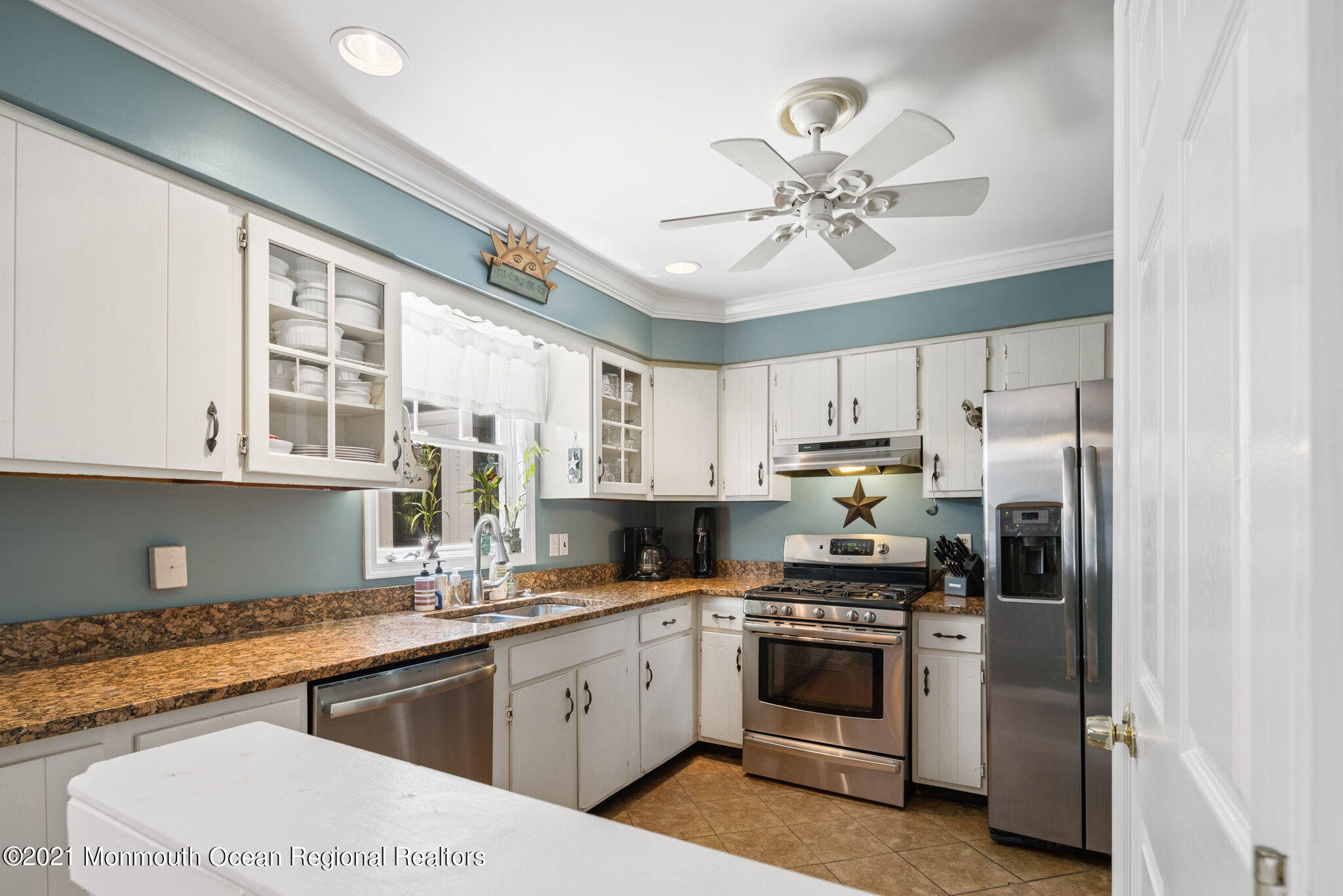 245 Crows Nest Road Manahawkin, NJ 08050 - Photo 16 of 79 a kitchen with stainless steel appliances a stove a sink and cabinets