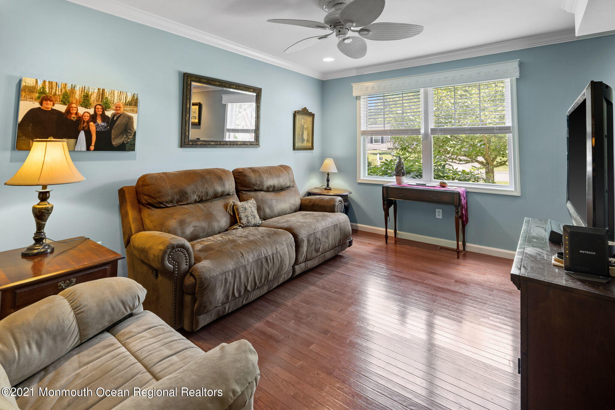 245 Crows Nest Road Manahawkin, NJ 08050 - Photo 17 of 79 a living room with furniture a large window and a flat screen tv