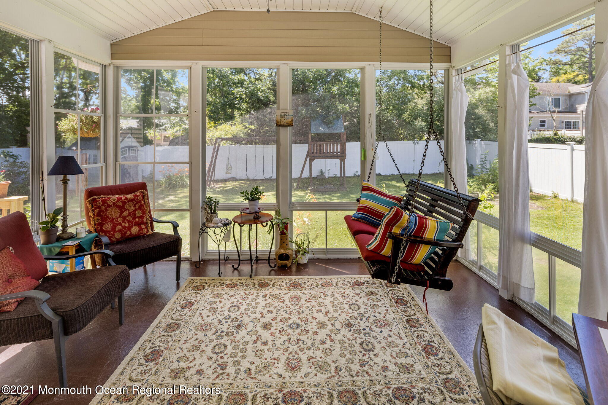 245 Crows Nest Road Manahawkin, NJ 08050 - Photo 23 of 79 a living room with furniture and a floor to ceiling window