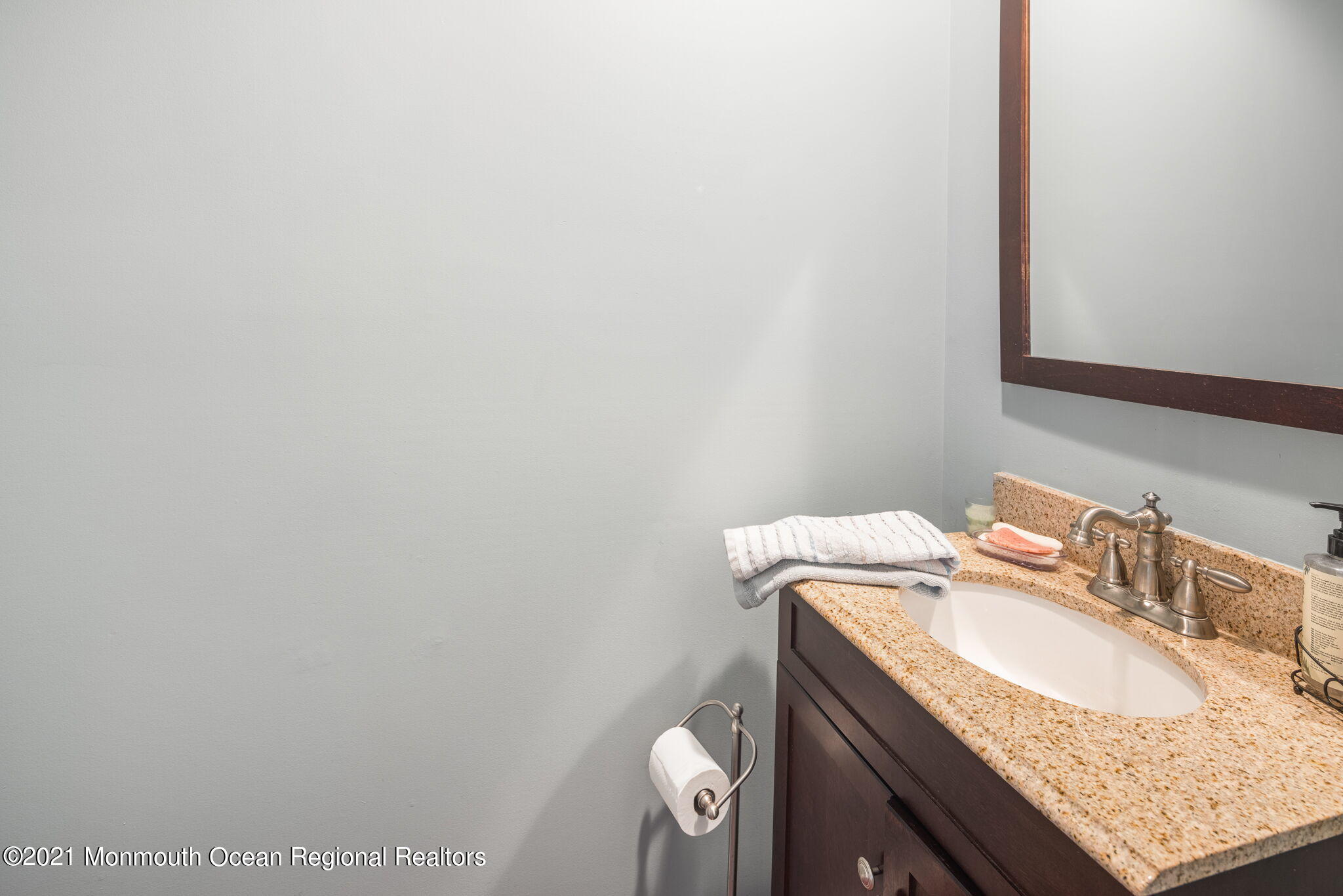 245 Crows Nest Road Manahawkin, NJ 08050 - Photo 25 of 79 a bathroom with a granite countertop sink and a mirror