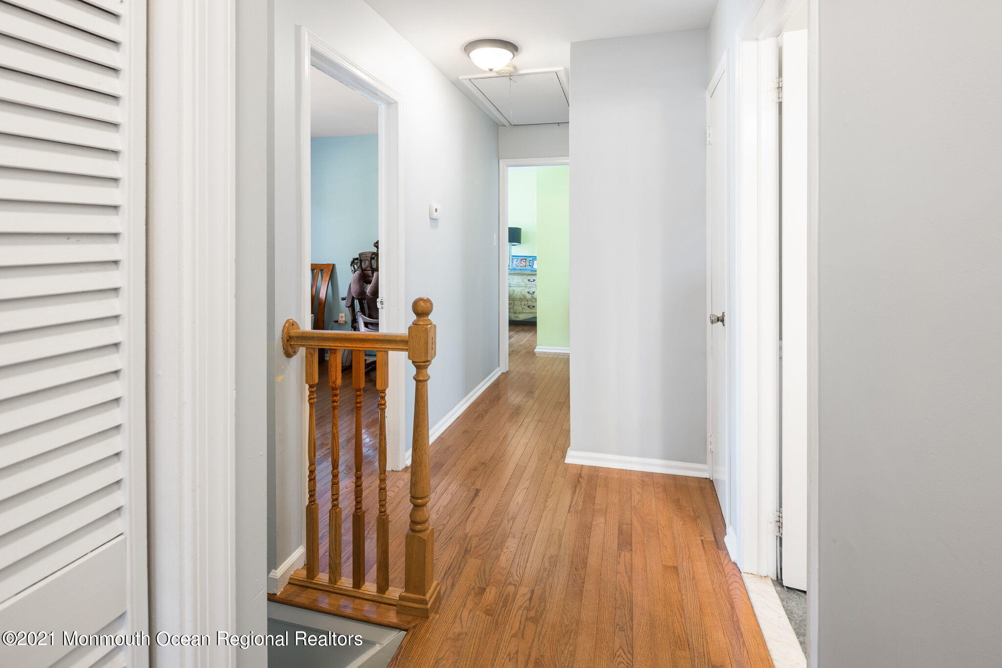 245 Crows Nest Road Manahawkin, NJ 08050 - Photo 28 of 79 a view of a hallway with wooden floor and staircase