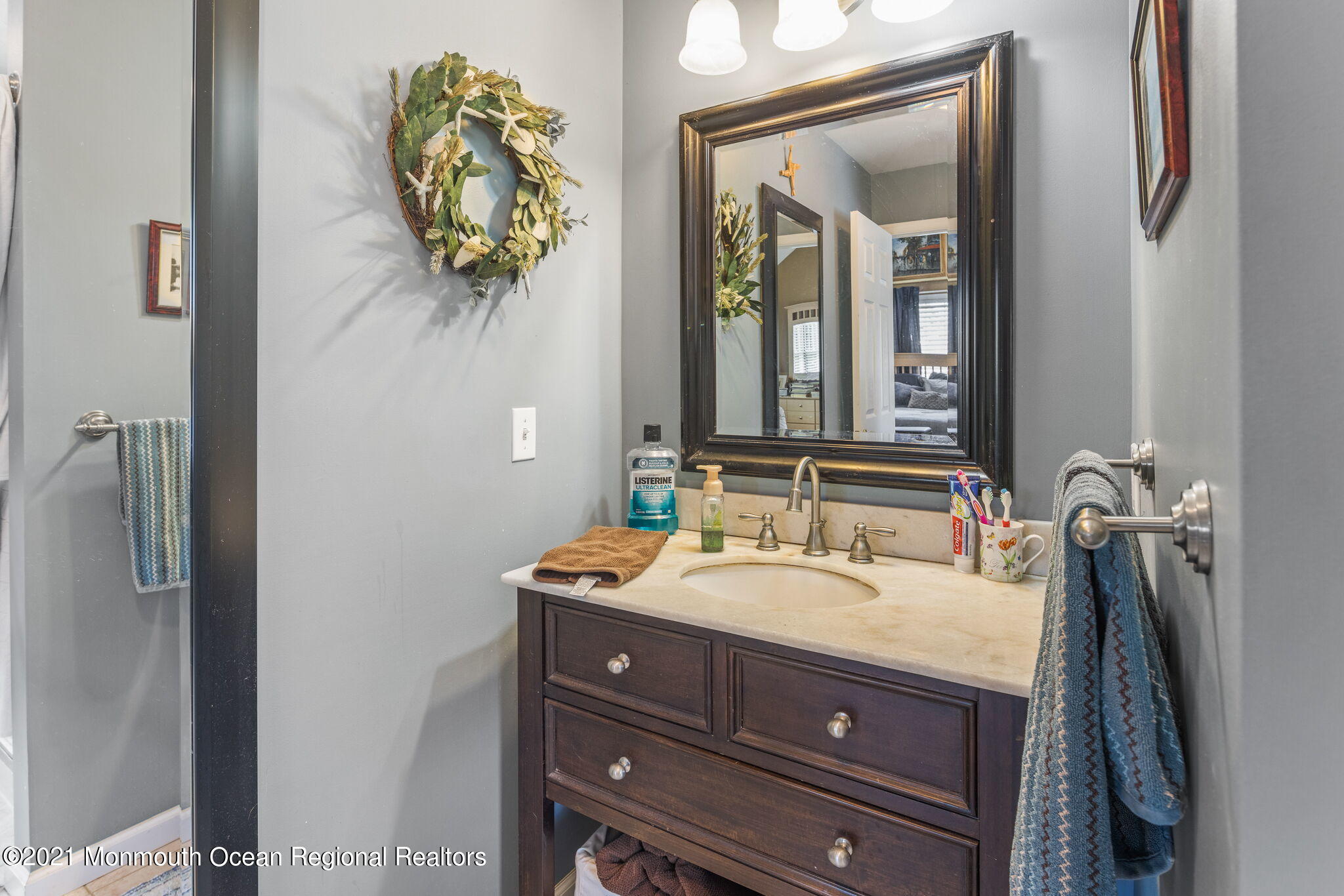 245 Crows Nest Road Manahawkin, NJ 08050 - Photo 34 of 79 a bathroom with a sink vanity and mirror