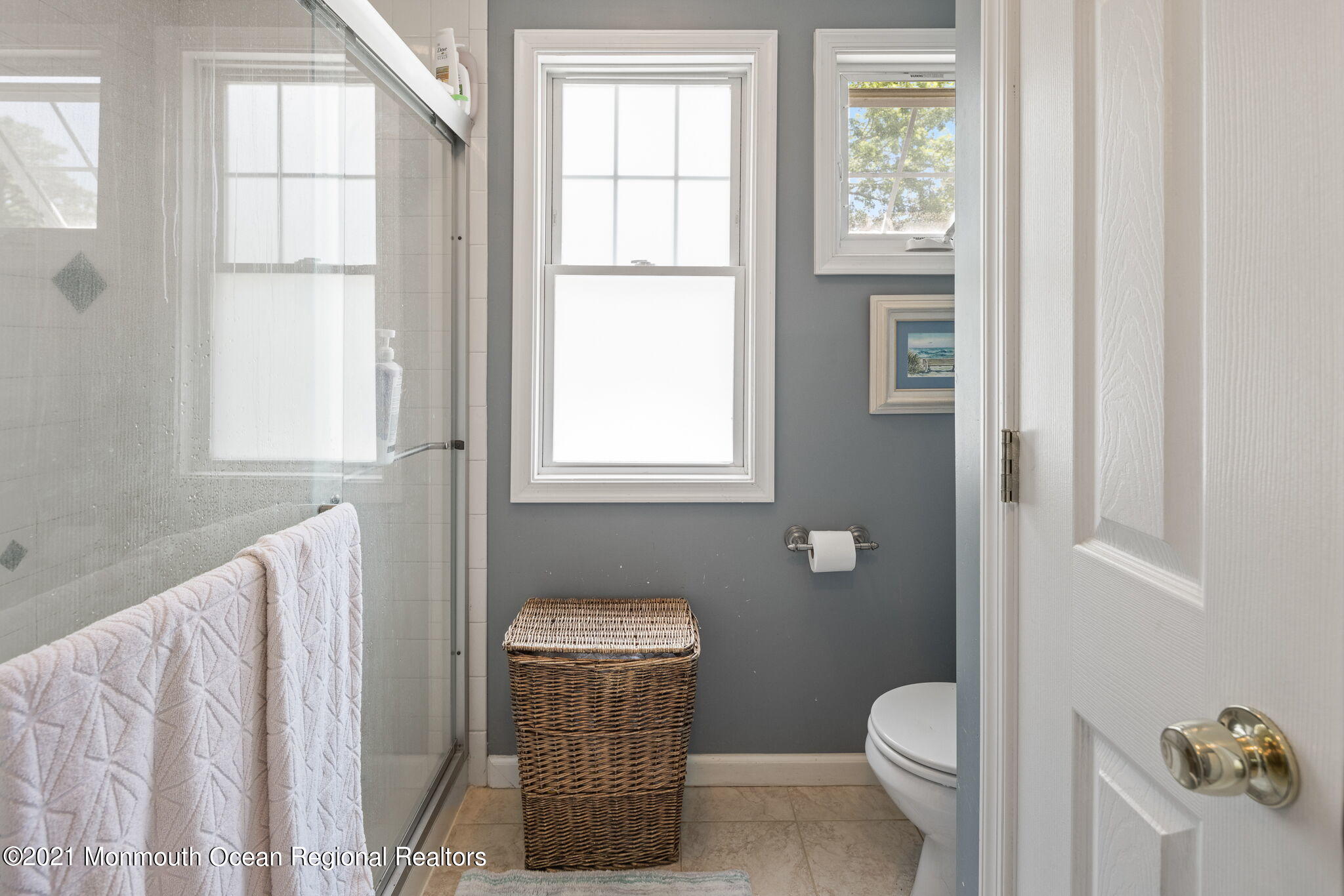 245 Crows Nest Road Manahawkin, NJ 08050 - Photo 35 of 79 a bathroom with a toilet a sink and a window