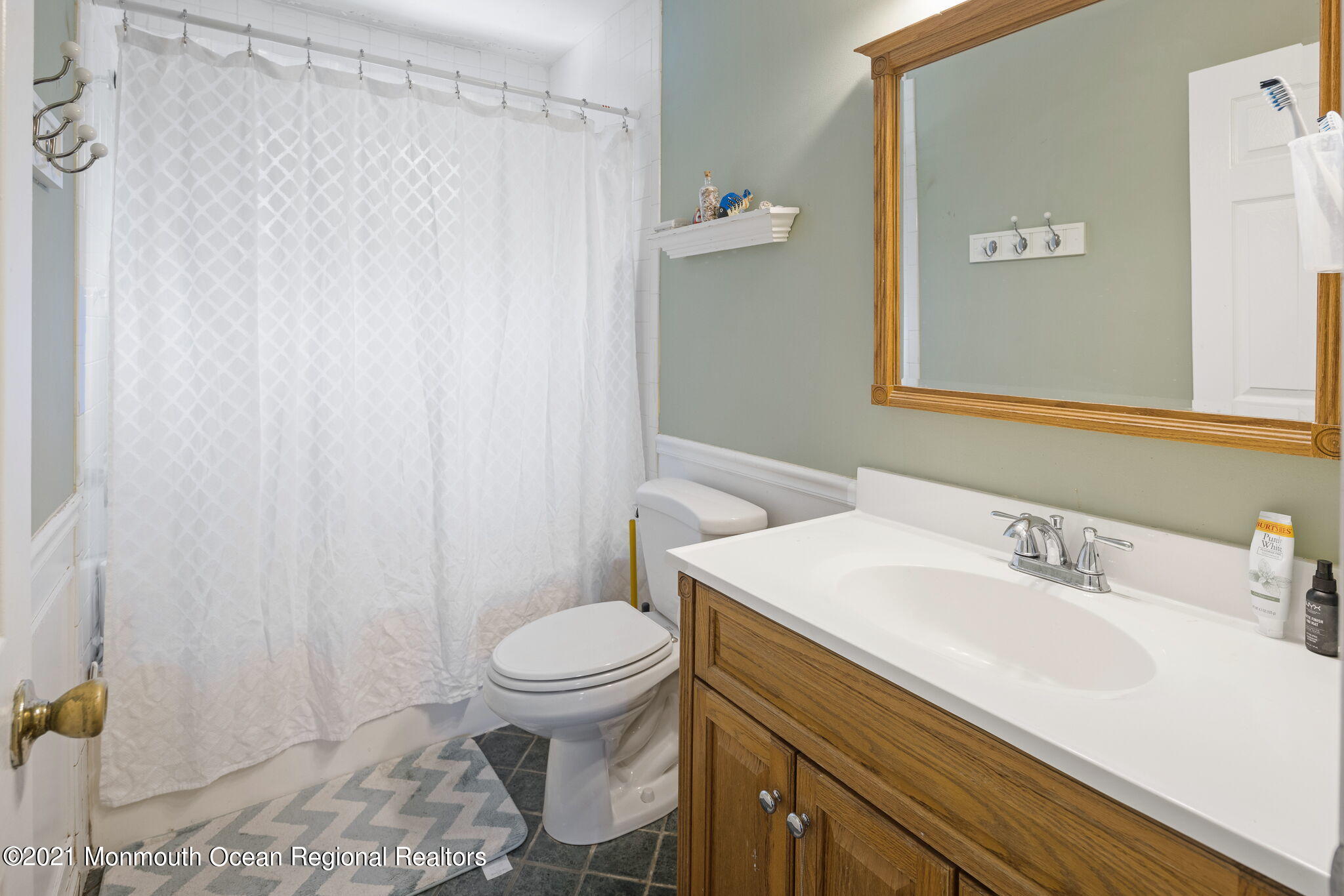 245 Crows Nest Road Manahawkin, NJ 08050 - Photo 39 of 79 a bathroom with a sink a toilet and a mirror