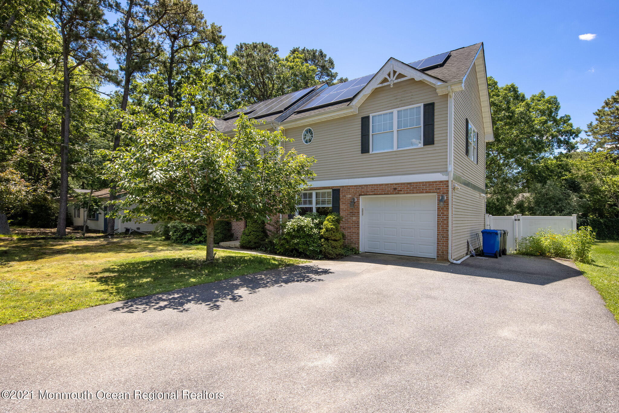 245 Crows Nest Road Manahawkin, NJ 08050 - Photo 51 of 79 a front view of a house with a yard and garage