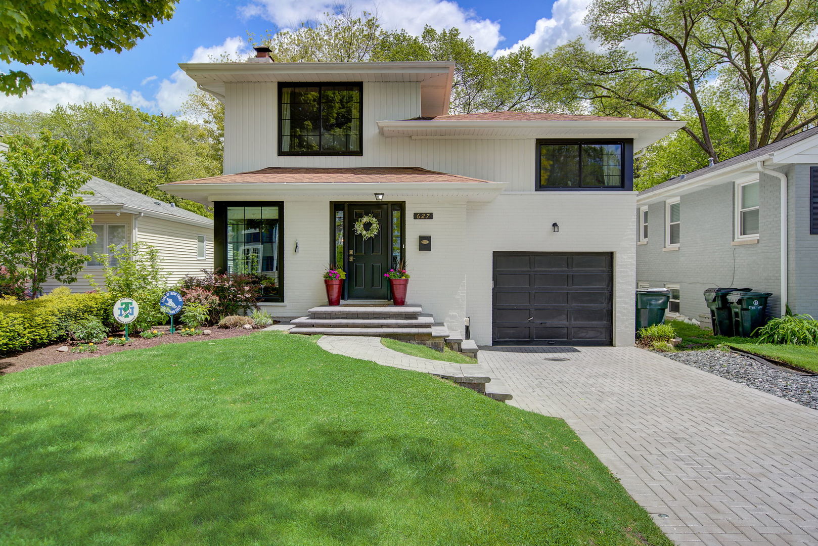 627 Beaver Road Glenview, IL 60025 - Photo 1 of 1 a view of a house with a yard and plants
