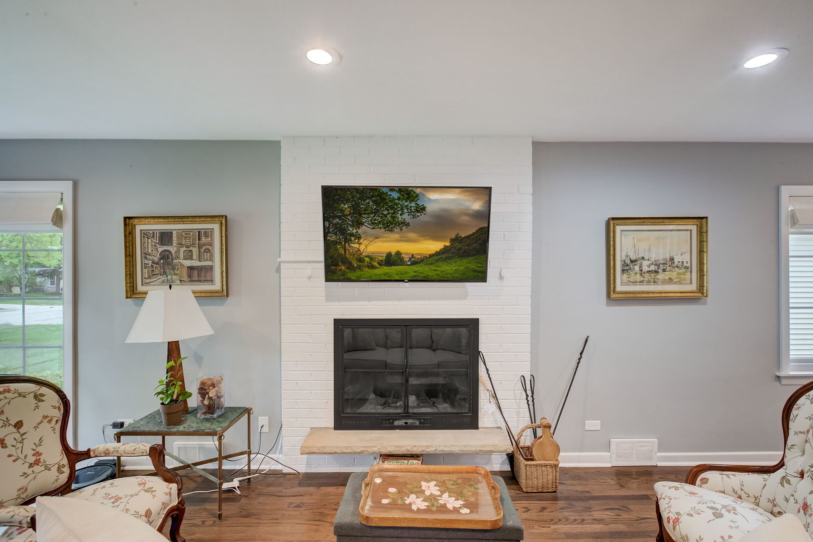 627 Beaver Road Glenview, IL 60025 - Photo 8 of 47 a living room with furniture a flat screen tv and a fireplace