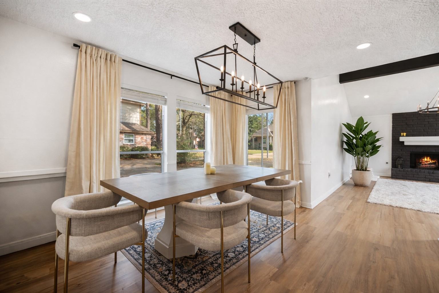 14907 Oak Bluff Court Houston, TX 77070 - Photo 11 of 19 a dining room with furniture a chandelier and wooden floor