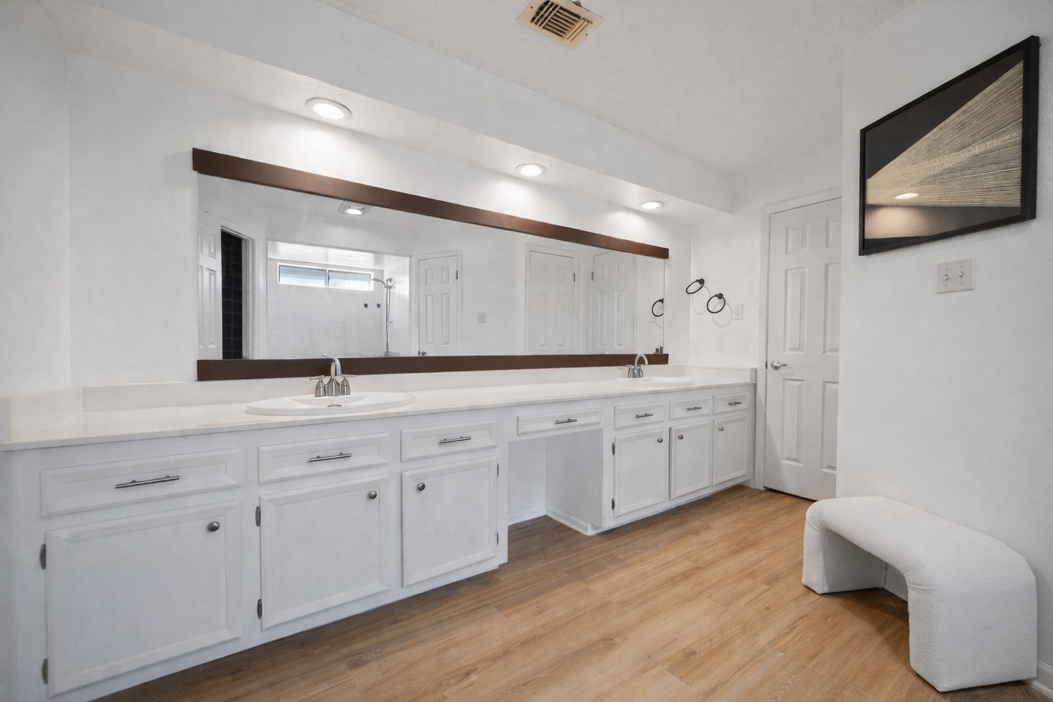 14907 Oak Bluff Court Houston, TX 77070 - Photo 14 of 19 a spacious bathroom with double vanity sink a two mirror a lamp a vanity and a window