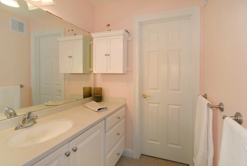 110 Summer Road, Unit 110 Boxborough, MA 01719 - Photo 17 of 28 a bathroom with a sink a vanity and a mirror