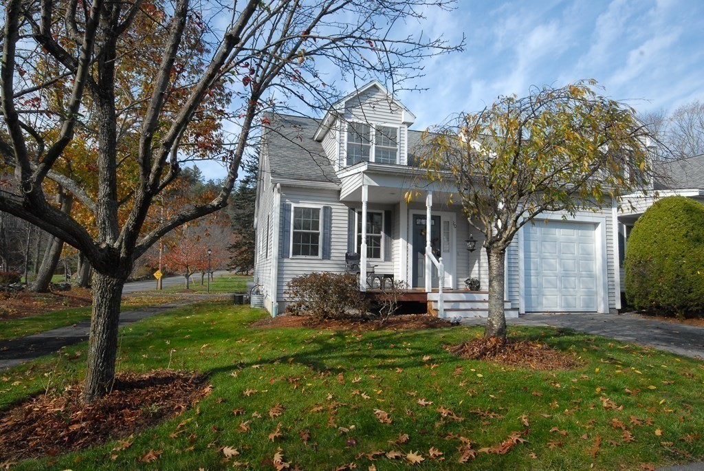 110 Summer Road, Unit 110 Boxborough, MA 01719 - Photo 3 of 28 a front view of a house with garden