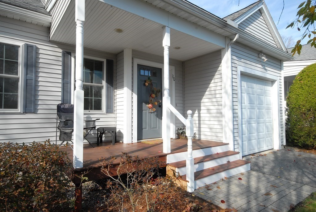 110 Summer Road, Unit 110 Boxborough, MA 01719 - Photo 4 of 28 a view of a house with entrance and porch