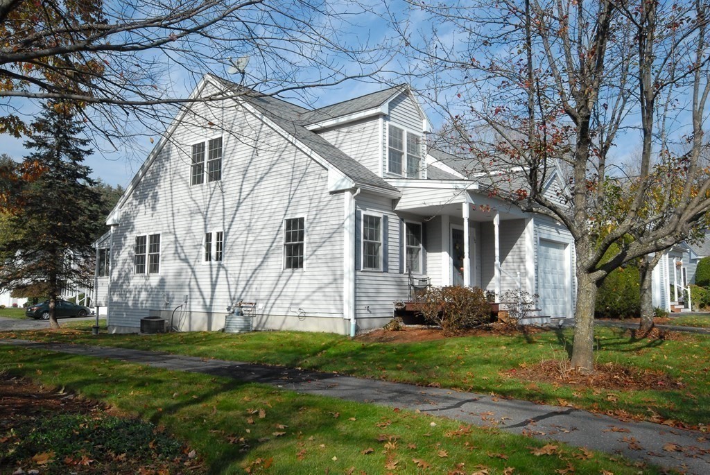 110 Summer Road, Unit 110 Boxborough, MA 01719 - Photo 5 of 28 a front view of house with yard