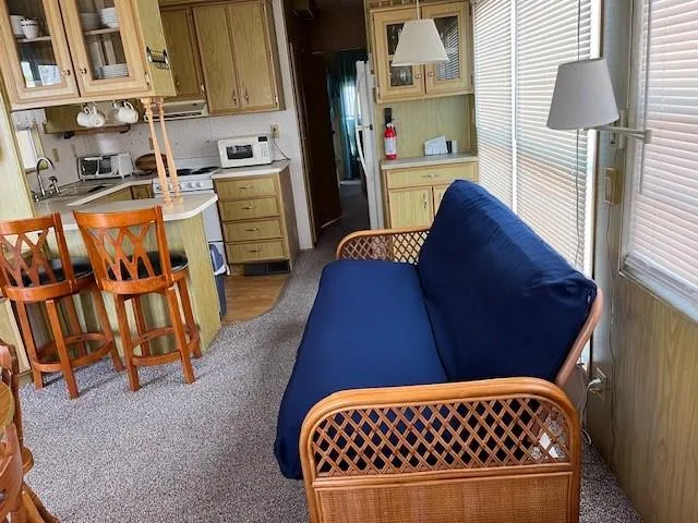 a bedroom with a bed and a mirror