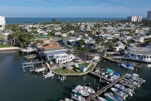 an aerial view of a house with a ocean view