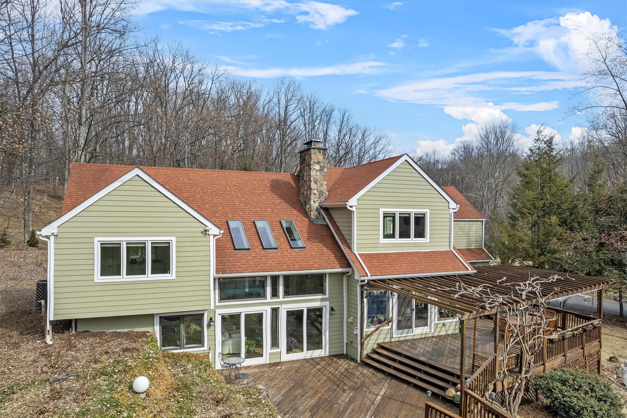 36 Chardavoyne Road Warwick, NY 10990 - Photo 43 of 46 Rear view of property featuring a chimney, roof with shingles, and a wooden deck